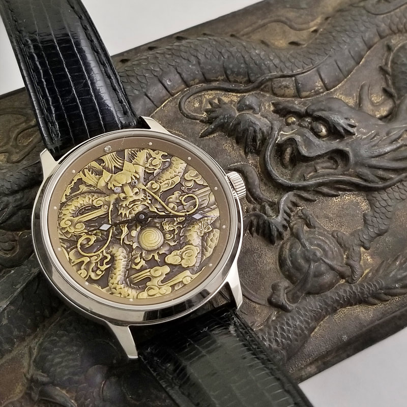 Sea-Gull 813.384 dragon dial with a dragon dial brass box background