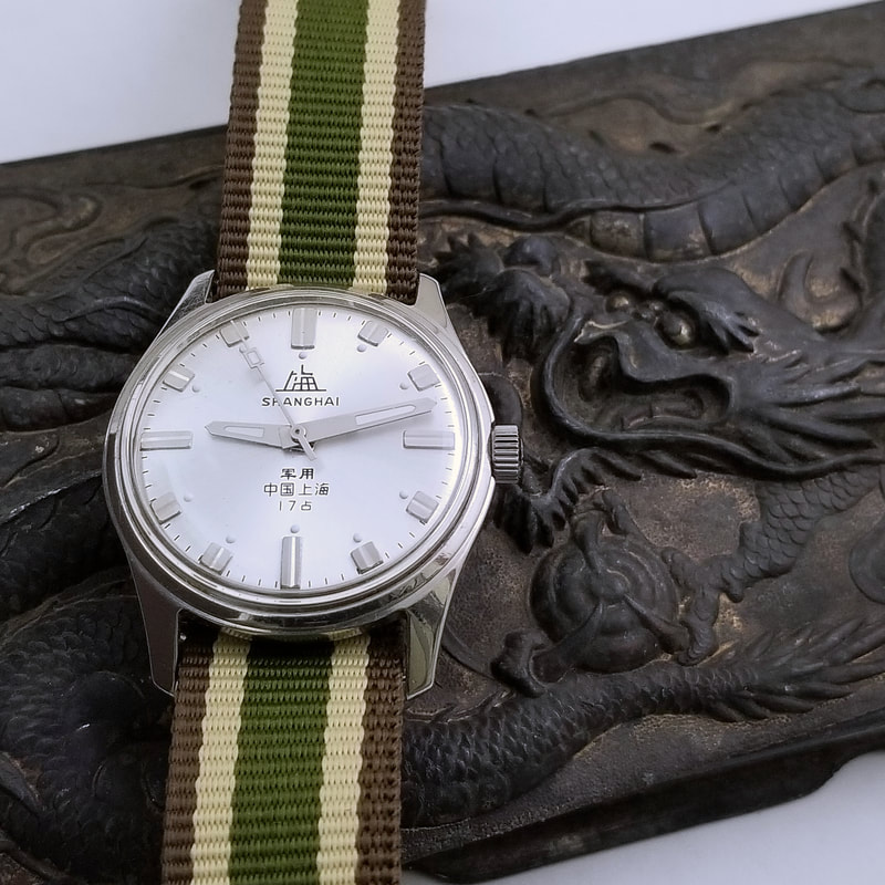 Shanghai modern homage tribute to a military use 军用  Shangai watch of the 1960s. The hands were quite different on the original.